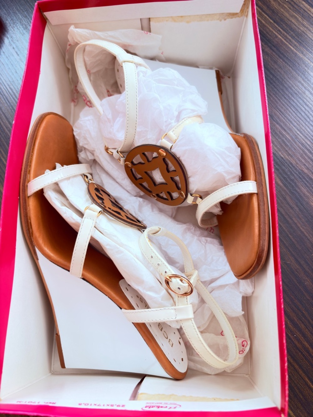 BCBGirls White Strap Sandals with Brown Medallion Accent